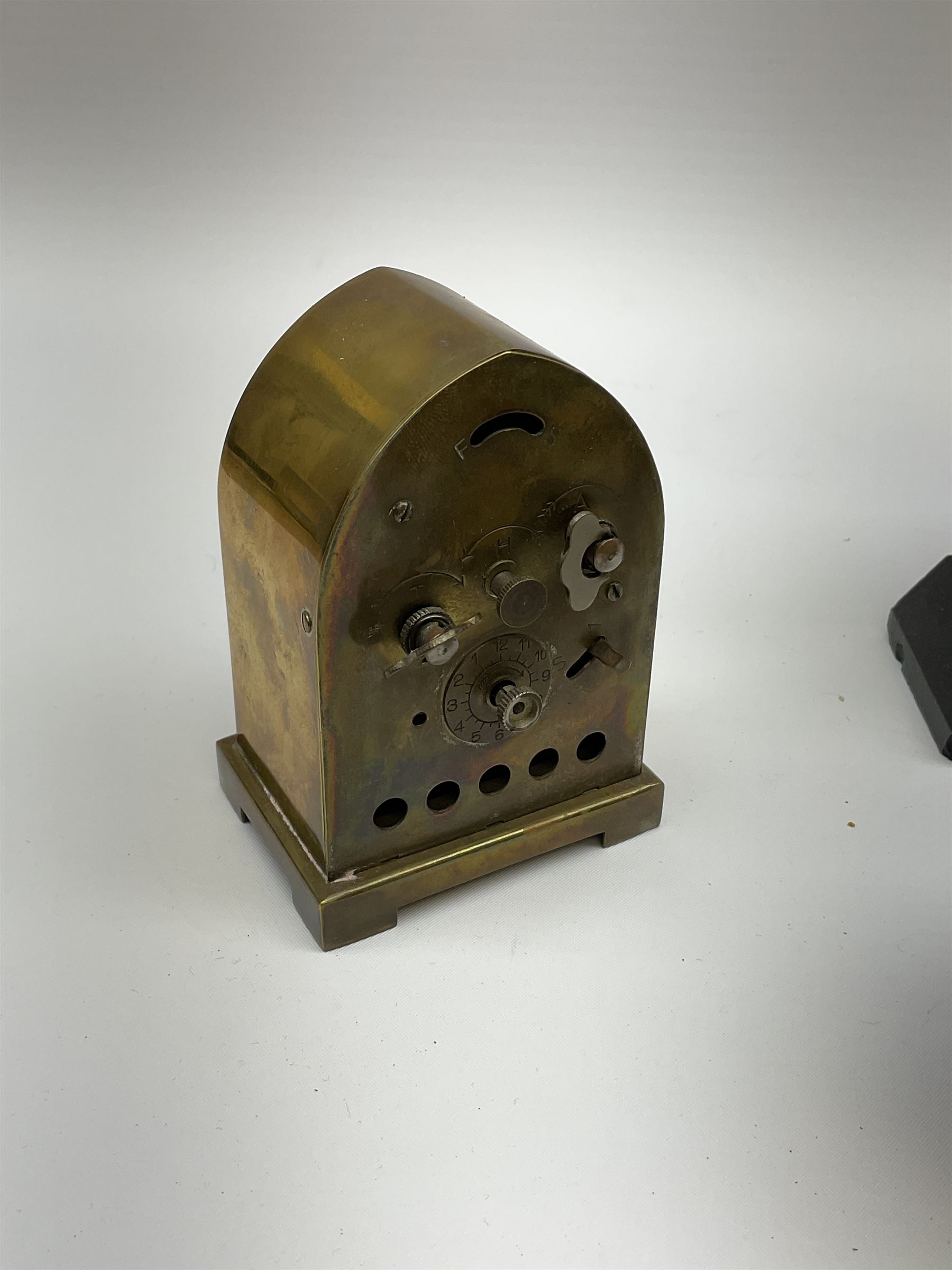 Miniature 'Zenith' travel alarm clock, in engine turned brass case with