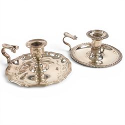 Silver plate two branch candelabra with grape vine decoration to the base, together with a matching pair of candle sticks and other candlesticks  