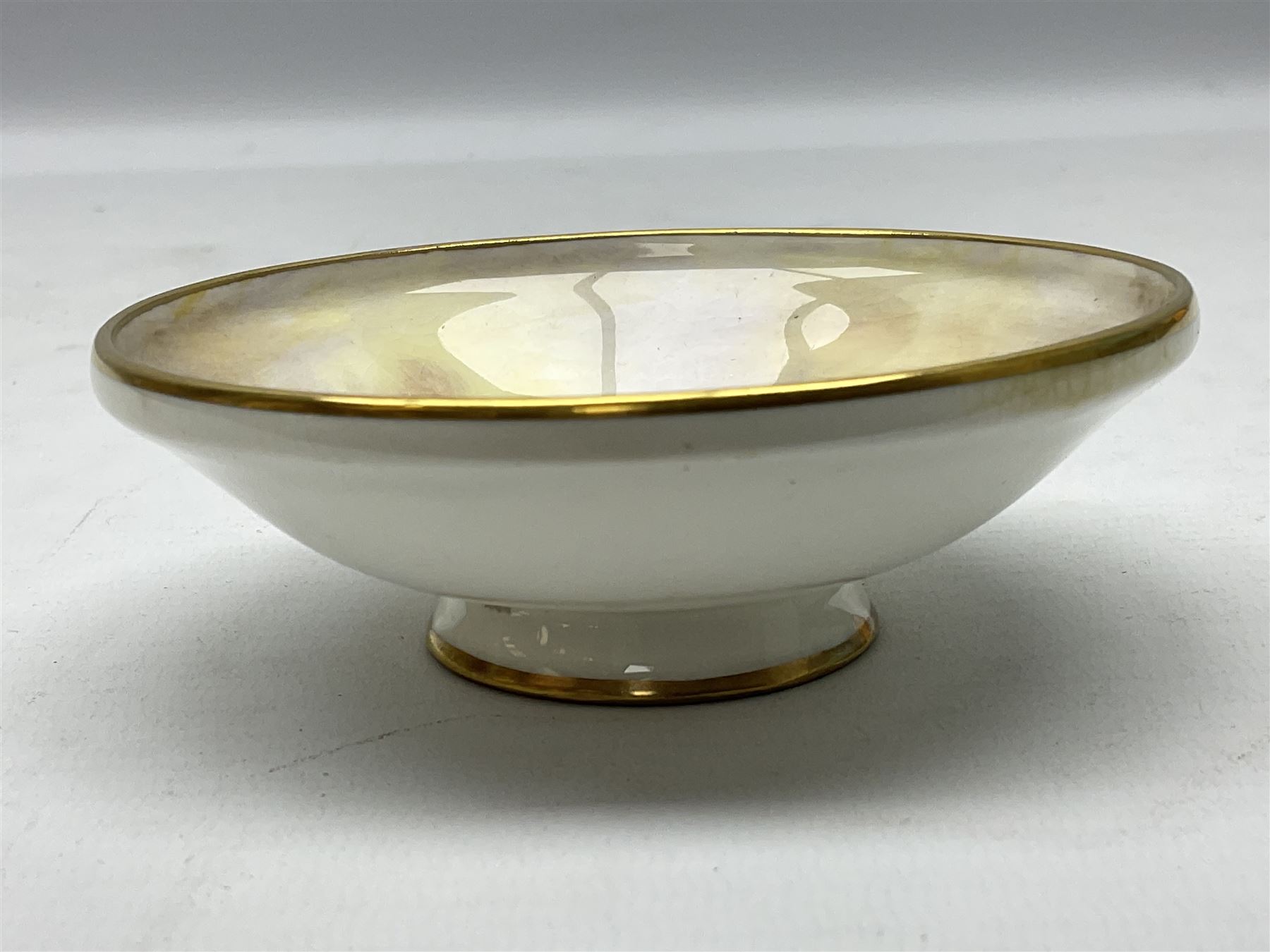 1938 Royal Worcester circular pedestal pin dish, decorated with pheasants in a landscape by James Stinton, with printed mark beneath, D10.5cm
