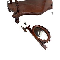Victorian mahogany etagere, raised oval mirror in fretwork frame, four graduating shaped tiers, spiral turned supports