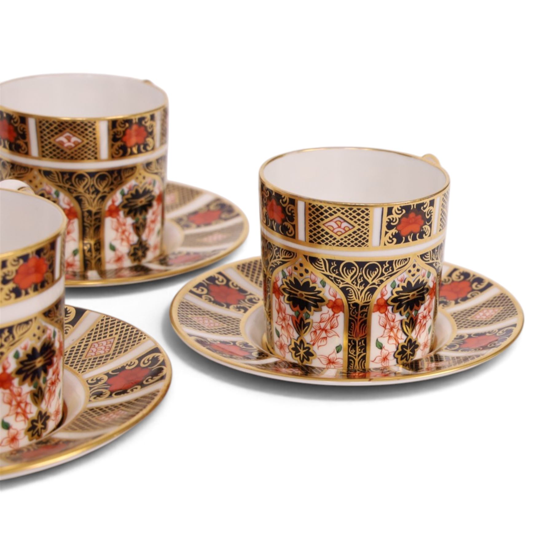 Eight Royal Crown Derby Old Imari 1128 pattern coffee cans and saucers