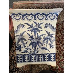 Chinese blue and white planter and stand, each of square slightly tapering and flared form, the planter decorated with two dragons and blossoming peonies, between stylised borders, the stand decorated with flower heads and vines, planter H30cm W29cm, stand H7cm D28.5cm