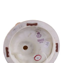 Royal Worcester pair of blush ivory candlesticks, modelled in the rococo style of scrolling foliate design upon a circular spreading base, gilt-heightened, puce mark to base and numbered RN160134 and 1478, H32cm