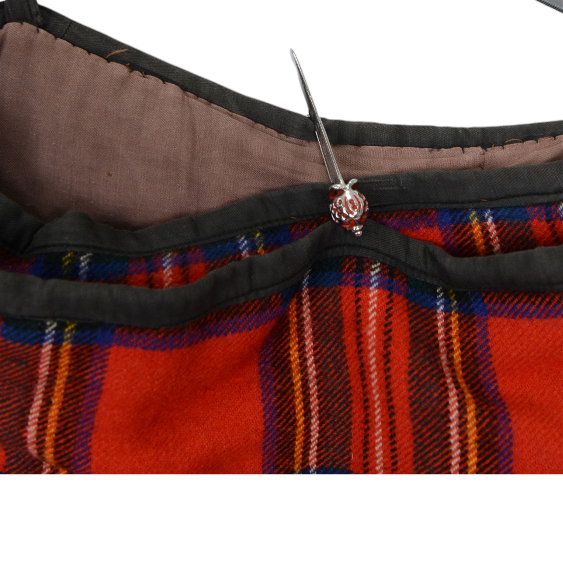 Set of mid 20th century bagpipes, with McLeod chanter, Royal Stuart cover, tassels, ribbons and spare accessories, contained within a wooden carry case, together with a Scarborough Highland Pipe Band uniform, comprising black highland dress jacket, Royal Stuart kilt, Glen Garry hat, Swinging Six sporren, Sgian Dubh knife, piper's dirk with knife and fork, etc