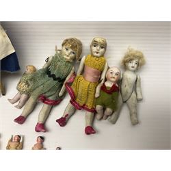 Twelve miniature bisque, bisque headed and wooden dolls to include articulated examples, tallest 12cm 