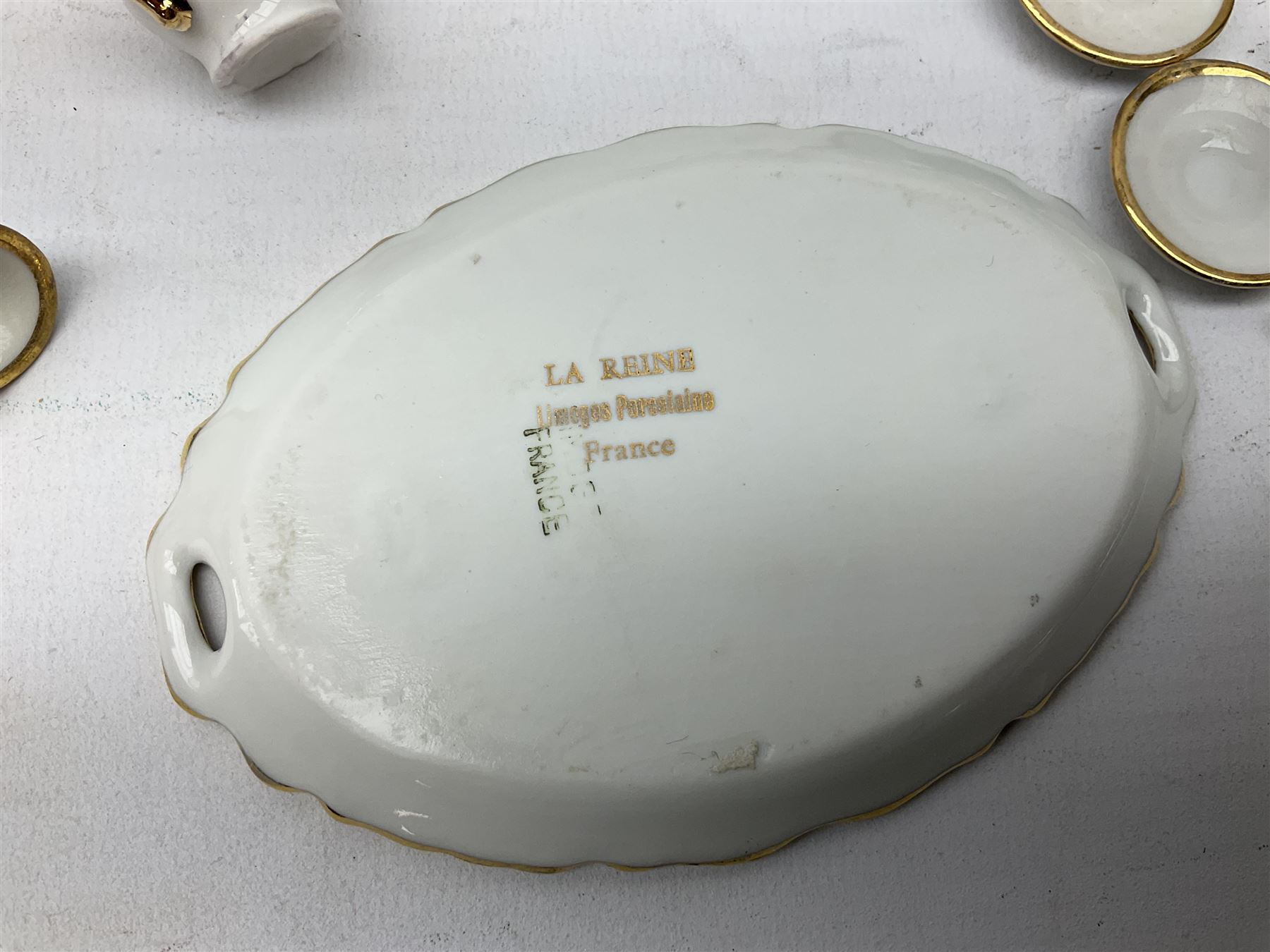 Limoges La Reine miniature furniture to include two chairs and table set, wardrobe etc, Limoges lidded boxes to include Bernadaud example, Limoges miniature tea service on tray, other boxes and miniatures to include Spode twin handled loving cup etc