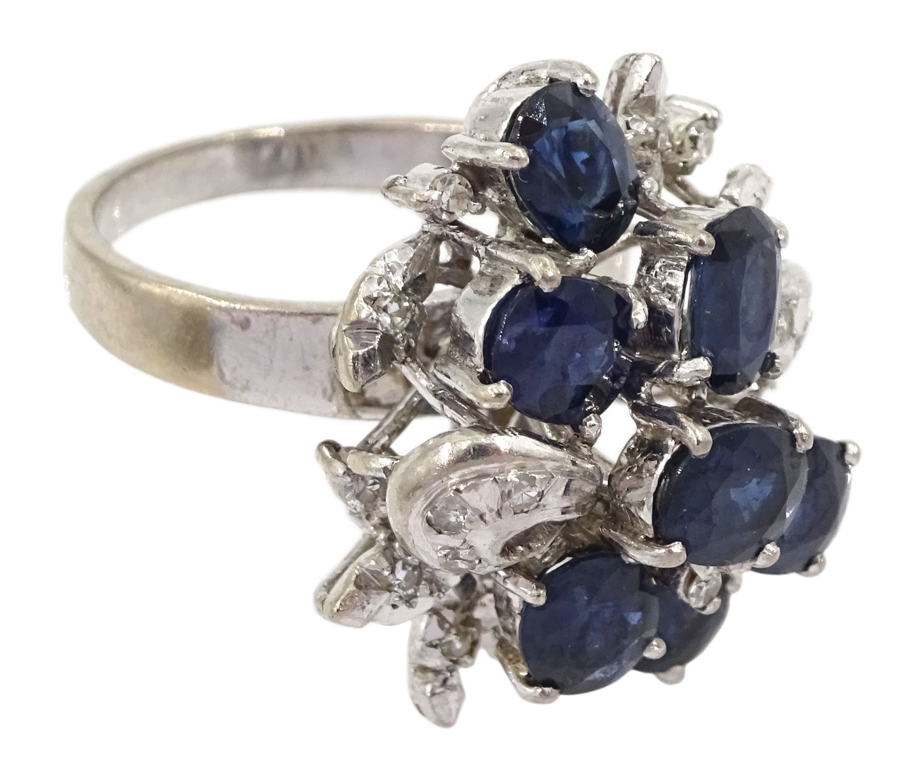 Oval cut sapphire and diamond cluster ring