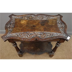  Victorian carved oak two tier table, shaped top, turned supports joined by undertier, W76cm, H75cm, D45cm  
