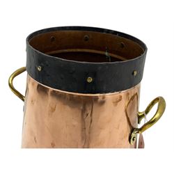 20th century copper milk churn, of tapering cylindrical form with applied brass twin handles and darkened banded rim and base