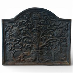 Early 20th century cast iron fireback, arched rectangular form cast in relief with a fruit...