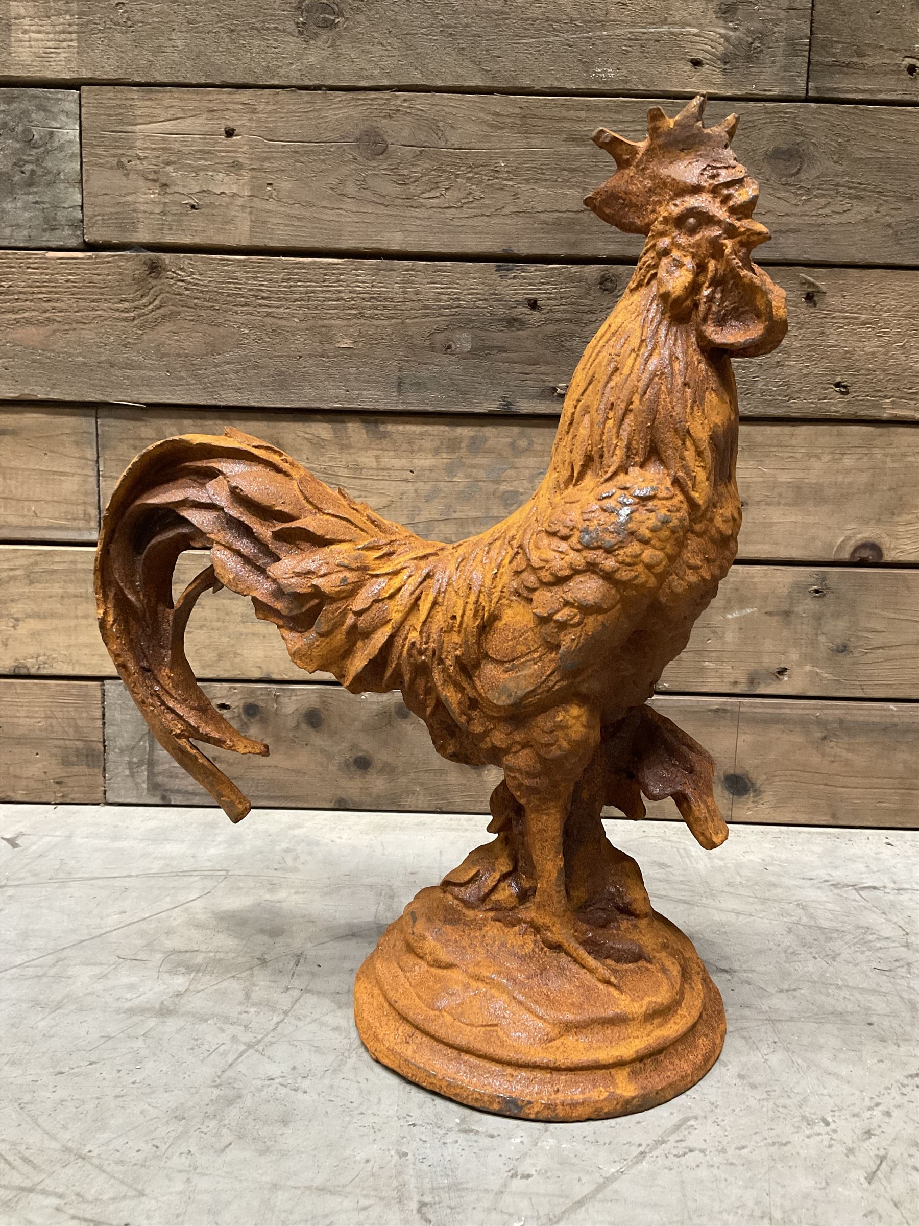 Small weathered cast iron garden cockerel