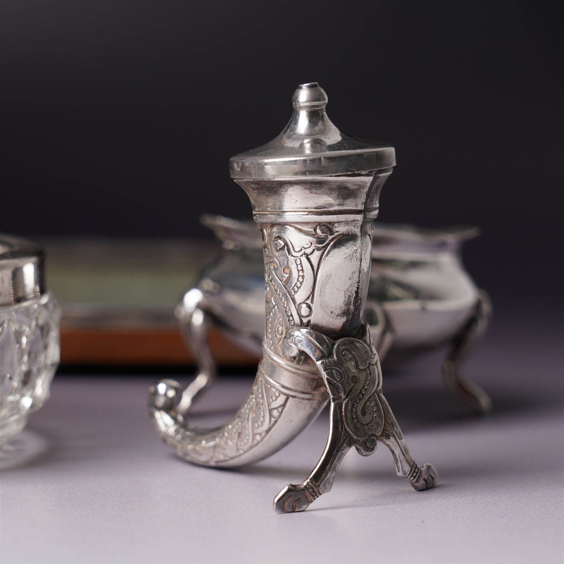 Pair of silver navette shape salts , cased Birmingham 1900 Maker Mitchell Bosley & Co., silver three piece condiment set, pair of silver cornucopia shape salts, silver upright photograph frame 17cm x 13cm and a pair of glass salts with silver rims