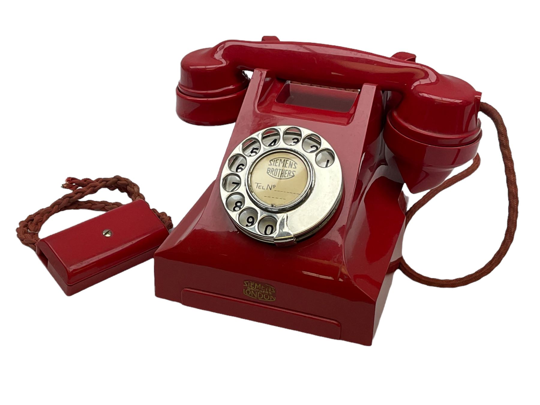 1950s Siemens Brothers red telephone with chrome rotary dial with enamel number plate and Siemens dial label, model 356, the body with base drawer below gilt logo, the handset with impressed mark PAT. 328926 PAT. SA 9/30, with red braided cord and red junction box (detatched), W15cm D18.5cm H14cm