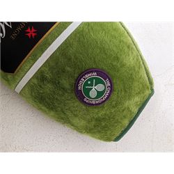 Three tennis balls, two with indistinct signatures, in Wimbledon Lansons Champagne cooler case