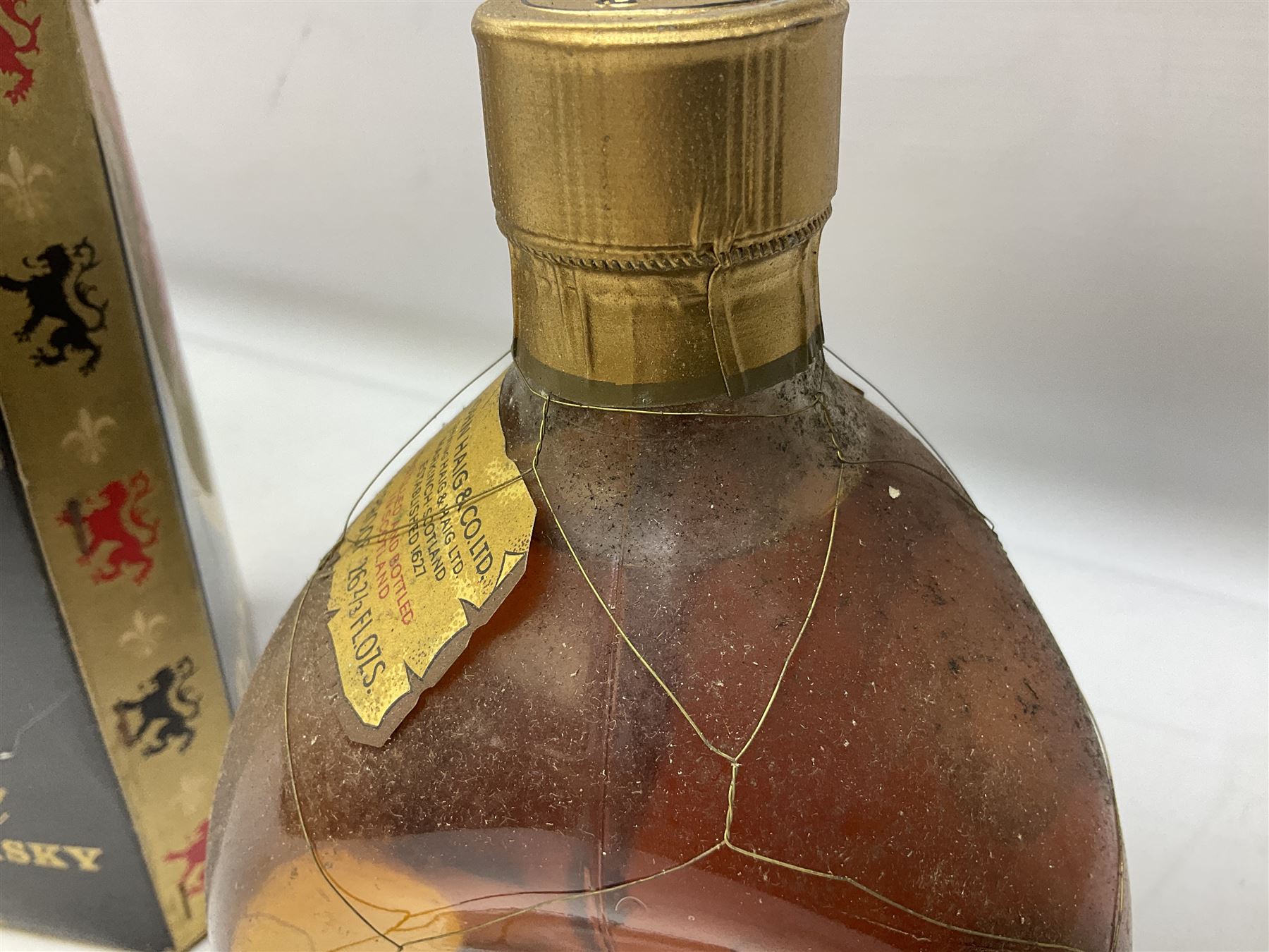 Four bottles of Haig's Dimple Old Blended Scotch whisky, all 26 2/3 Fl.OZs, 70 proof, one in original box and a bottle of East India 1961, Madeira, unknown contents and proof