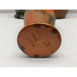 Burmantofts Faience vase, with elongated neck, and concentric circle decoration, in a green lustre glaze, together with a Bretby figure, modelled as a cat with a ball of wool, a Bretby vase, with fluted rim, in orange/red glaze, frog jug and a large West German vase, tallest H38cm