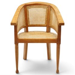Late 20th century Anglo-Indian teak framed bergère armchair with canework back and seat, raised on tapering supports
Provenance: purchased Liberty & Co in the 1990s from the oriental line