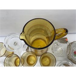 Amber glass lemonade pitcher with four glasses, together with apple shaped bowls and other glassware 