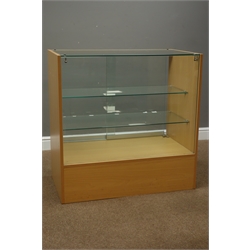  Light wood and glazed shops display cabinet enclosed by sliding glass doors, with two glass shelves and drawer, W91cm, H91cm, D50cm - no key  