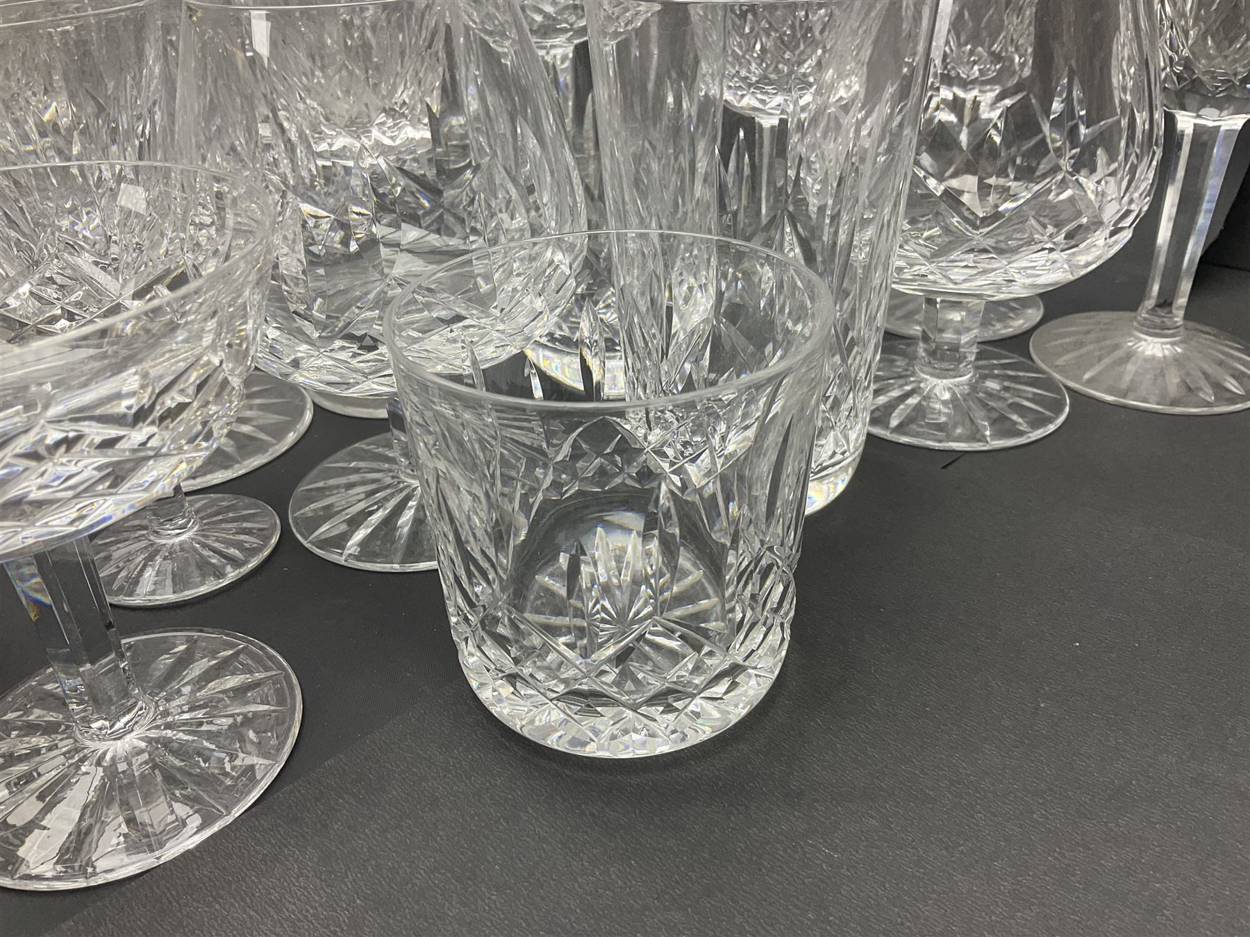 Set of Waterford Crystal Lismore pattern drinking glasses for six people, including hock glasses, goblets, champagne flutes,  sherry glasses, liqueur glasses, hi ball glasses, whisky glasses, brandy balloons, etc, all with etched maker's mark beneath  (62)