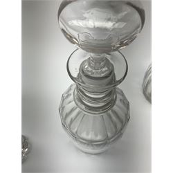 A group of six ring neck decanters, Georgian and later, with varied cut/sliced decoration, (stoppers not all original), including stopper largest H26cm. 