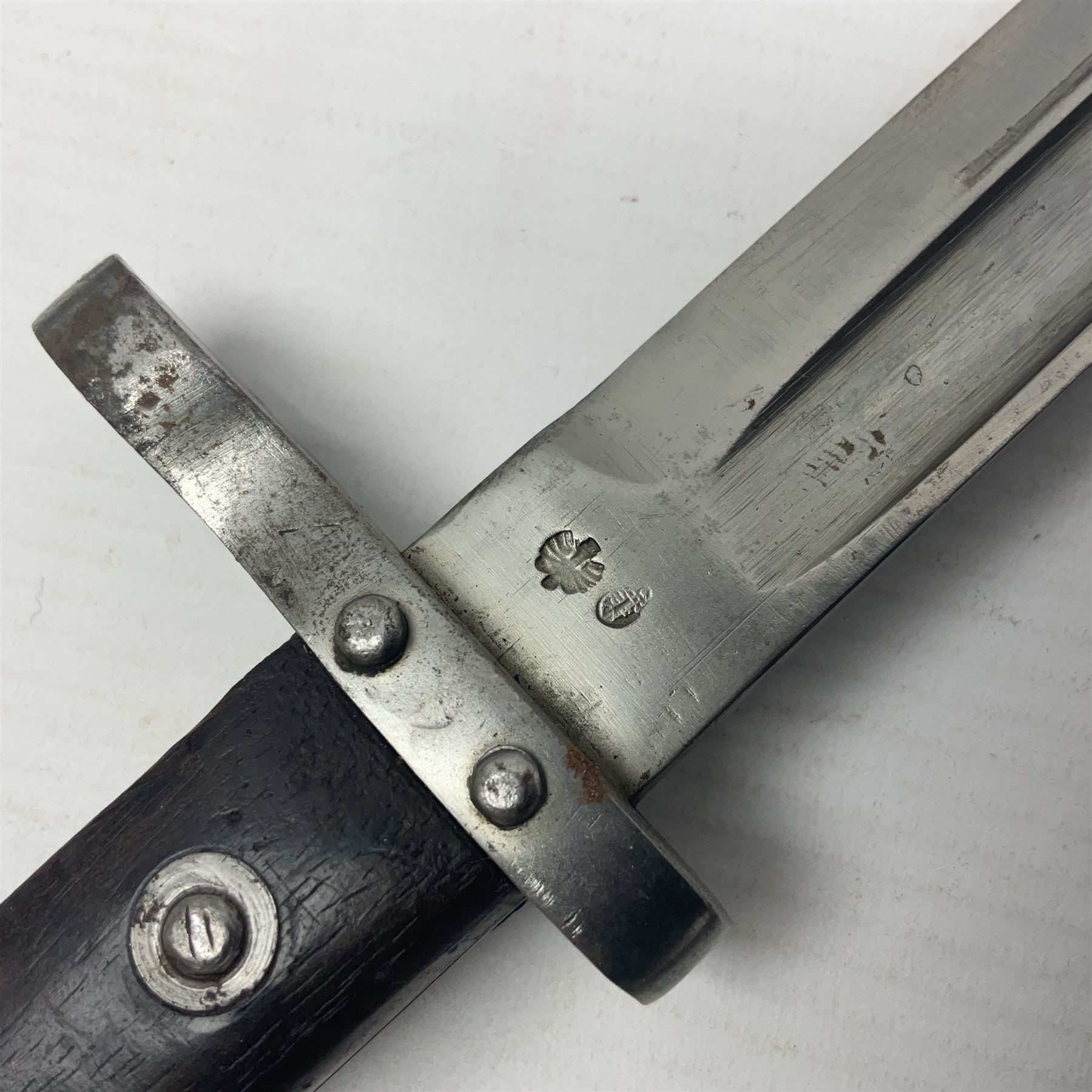 Austrian Model 1895 Carbine knife bayonet with 24.5cm fullered steel blade; various marks to the ricasso including F.G. GY.; cross-piece marked No.7843; in steel scabbard L37cm overall
