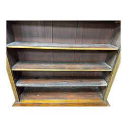 Early 19th century mahogany bookcase on cupboard, projecting cornice over four adjustable shelves, the cupboard enclosed by two sliding panelled doors, on moulded plinth base 