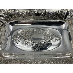 Large Victorian silver dish, of oblong form with embossed foliate decoration and cast foliate, scroll and palmette rim, upon four foliate cast feet, hallmarked W & G Sissons, London 1895, H9.5cm L36cm W27cm