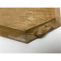 Mouseman - adzed oak chopping board, elongated octagonal form, moulded edge carved with mouse signature, by the workshop of Robert Thompson, Kilburn