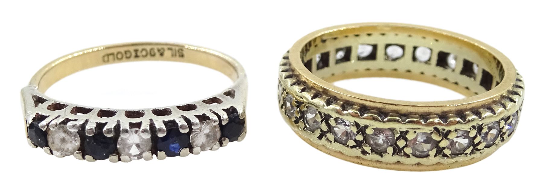 9ct gold jewellery including articulated fish pendant, cameo ring, stone set full eternity ring and stone set ring and a silver textured link bracelet