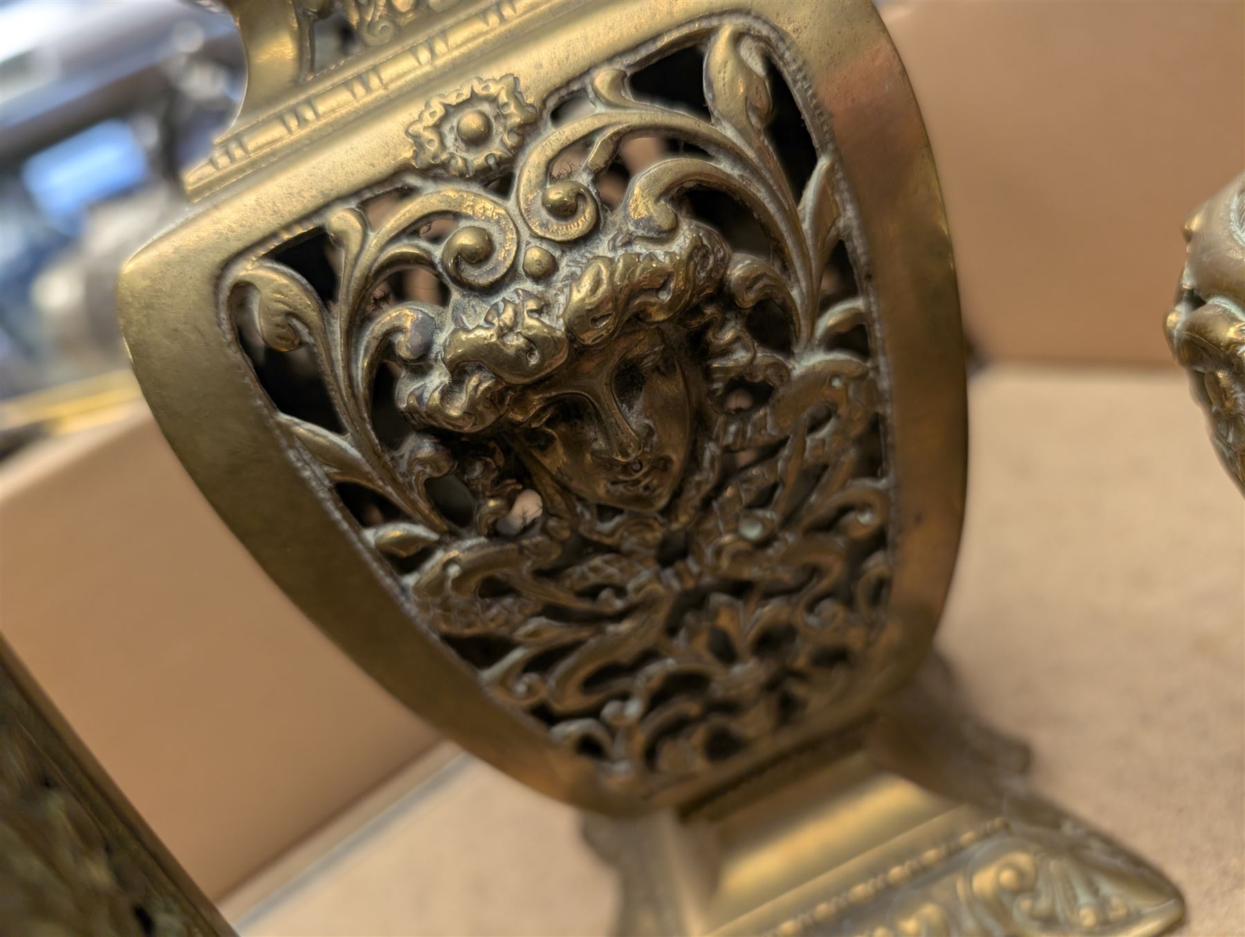 Brass twin handled planter, pair of pierced brass bottle neck vases and three other brass vases