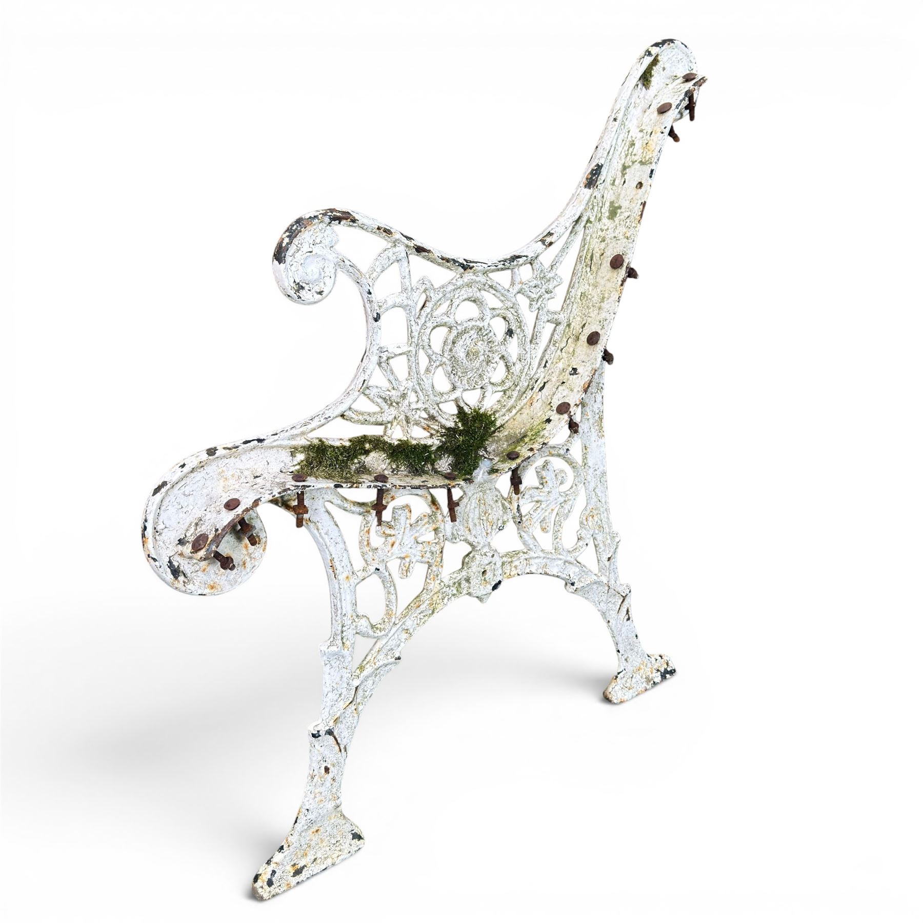 Pair of ornate painted cast iron bench ends, painted in white finish