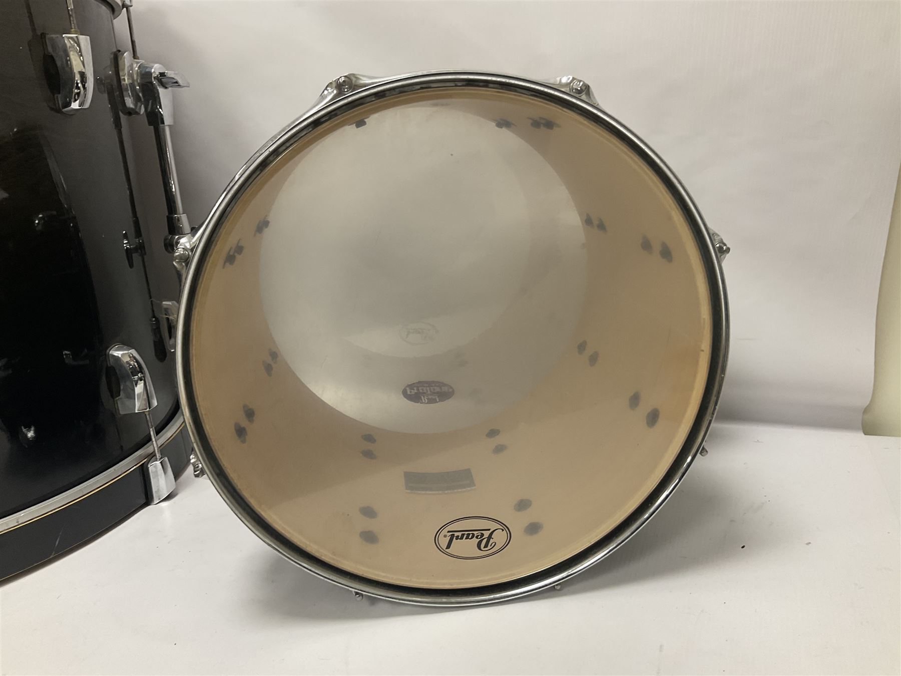 Pearl Vision SST Birch Ply shell four-piece drum kit in black comprising bass drum with foot pedal and three graduated toms; together with Pearl Custom Alloy Sensitone steel snare drum, drum and cymbal stands, microphone stand, stool and various drum sticks 