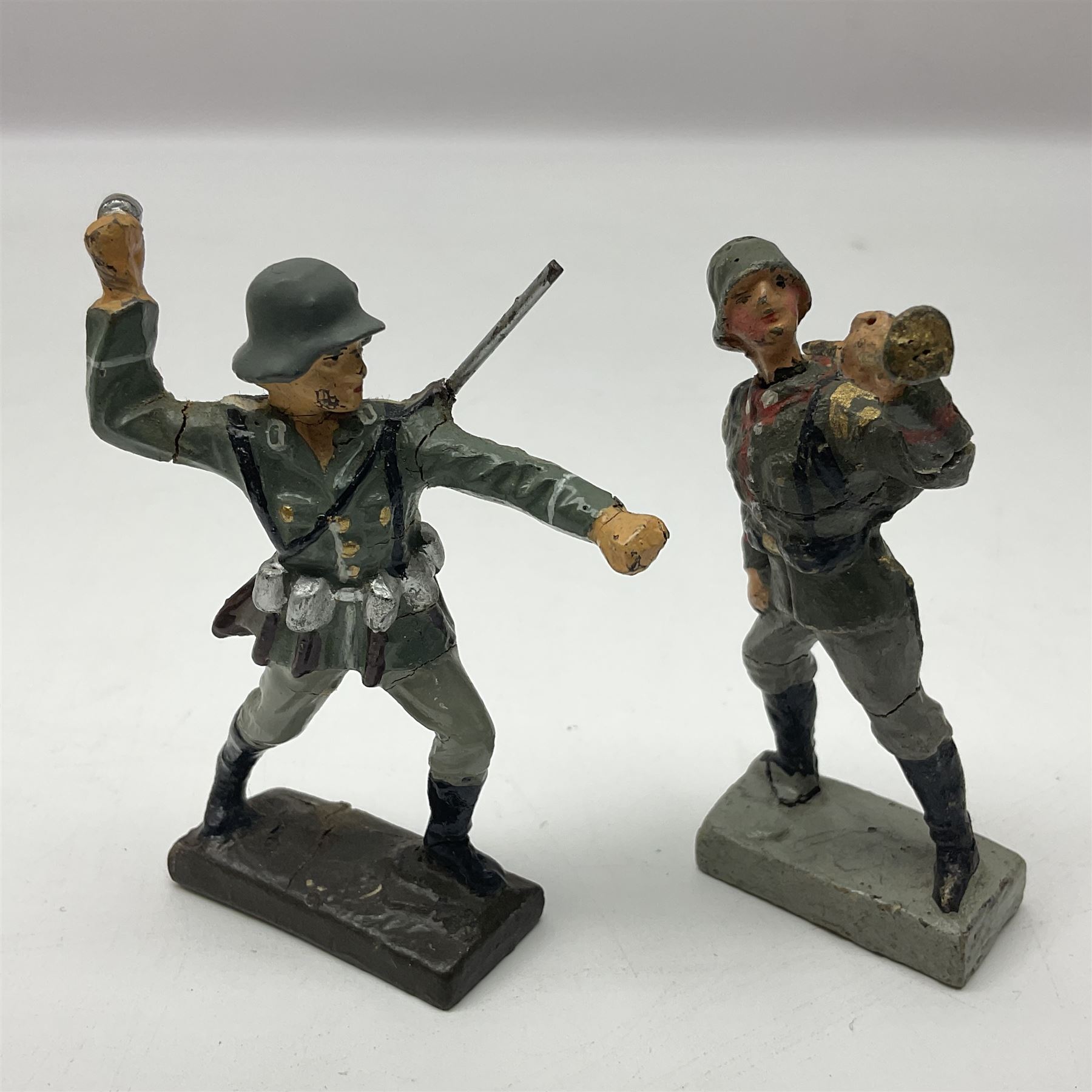 German Lineol Flak Artillery Gun on revolving base H11cm; four other Lineol WW2 German soldiers; and three Elastolin German soldiers including reclining radio operator (8)