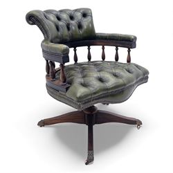 Mid 20th century buttoned green leather office chair, the curved back and arms over a circ...