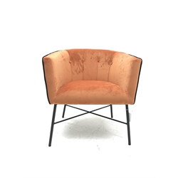 Tub shaped easy chair upholstered in bright rust velvet, metal X framed base, W68cm
