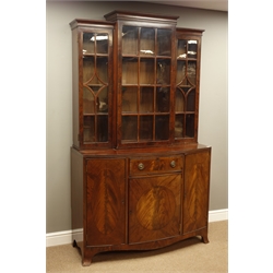  Late 19th/early 20th century mahogany cabinet, raised break front bookcase enclosed by three astragal doors, above bow front cabinet with drawer and three figured cupboard doors, splayed bracket feet, W122cm, H209cm, D54cm  