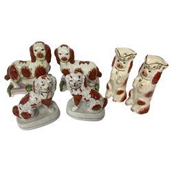 Two pairs of Staffordshire style dogs, together with a pair of Staffordshire style jugs, jug H24cm