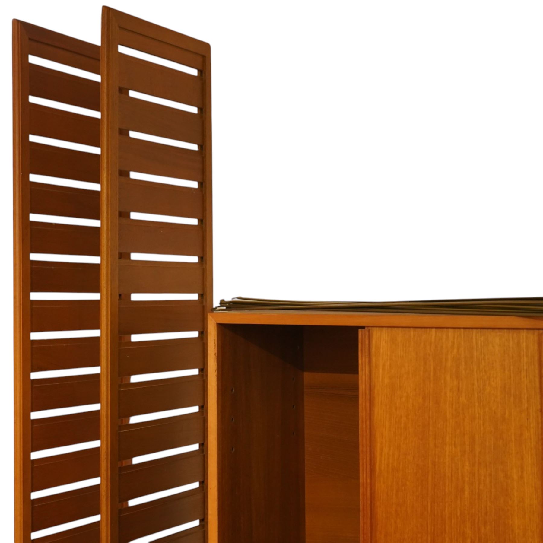 Ladderax - mid 20th century teak modular wall unit, comprising two sliding door cabinets, one fall-front cabinet, six shelves, four ladder supports and fourteen metal cross braces