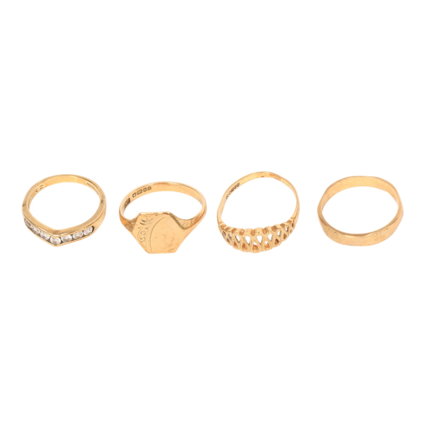 Four 9ct gold rings including cubic zirconia wishbone, all hallmarked