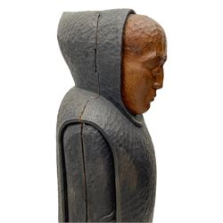 John Bunting FRBS, FRCA (1927-2002): Carved sculpture of a standing Monk in ebonised robes