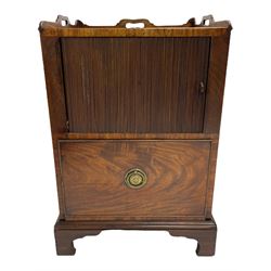 George III mahogany night cabinet commode, the three-quarter raised gallery with pierced handles, above a cupboard enclosed by a tambour door, the cock-beaded lower drawer with bowl rest and basin, the pressed brass rosette plate with ring handle, lower moulded edge over bracket feet

Provenance - from Rolston Hall in Hornsea.