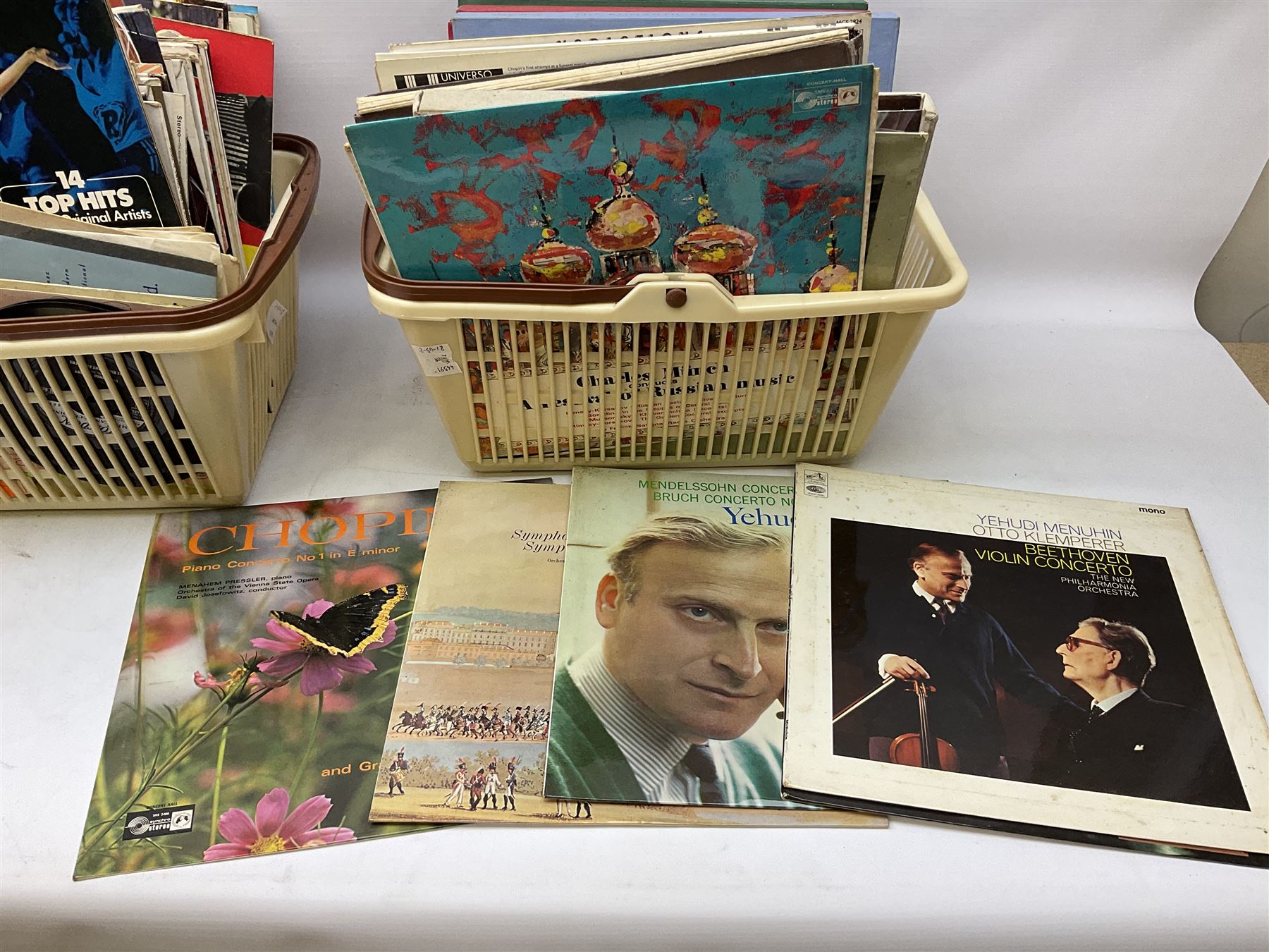 Wooden magazine rack, with floral detail, together with a collection of records, to include the box sets 'the Story of Great Music', 'Popmobility', Happy Holiday in Greece  etc, in three boxes 