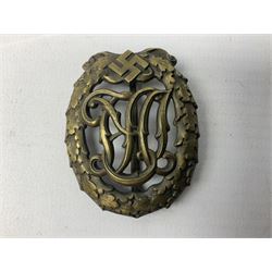 Two WW2 German Sports badges - SA sports badge marked verso 'W.Redo Eigentum D. Obersten SA. Fuhrung Saar Lautern'; and DRL sports badge marked verso 'Wernstein Jena D.R.G.M. 35269' (2)