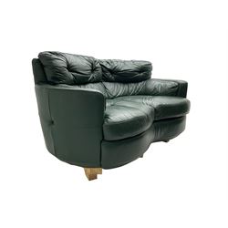 Two seat serpentine sofa, upholstered in green buttoned leather