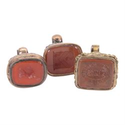Collection of four 19th century gold plated seals with carnelian matrixes, together with three seals including an agate example, largest seal H3.5cm
