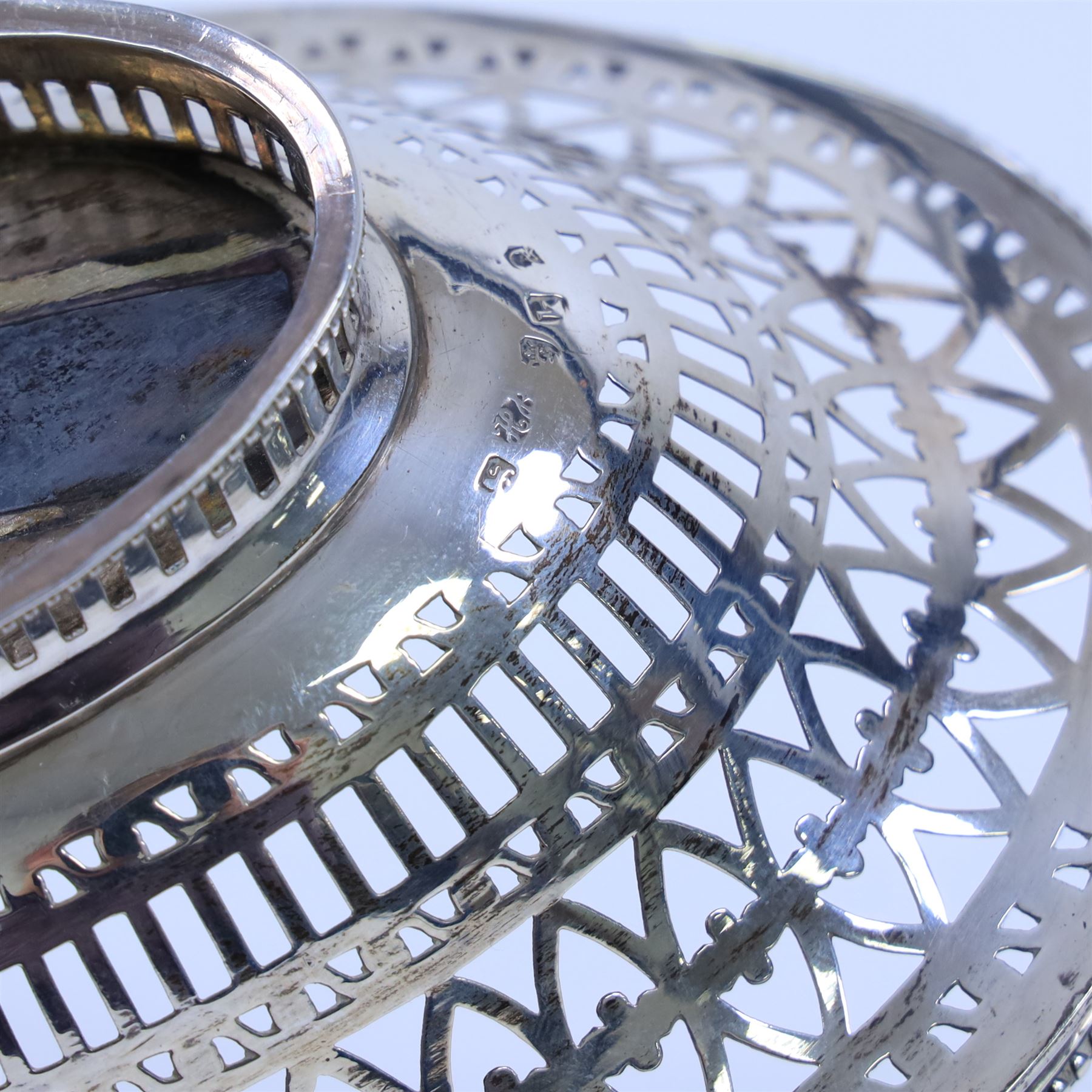 George III silver bon bon basket, of oval form with bead rim and swing handle, the sides with pierced latticework decoration, hallmarked Hester Bateman, London 1785, handle H14cm