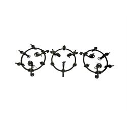 Set of three mid-20th century wrought iron six-light chandeliers, each with a circular frame with scrolled arms, faux candle sleeves and hook terminals