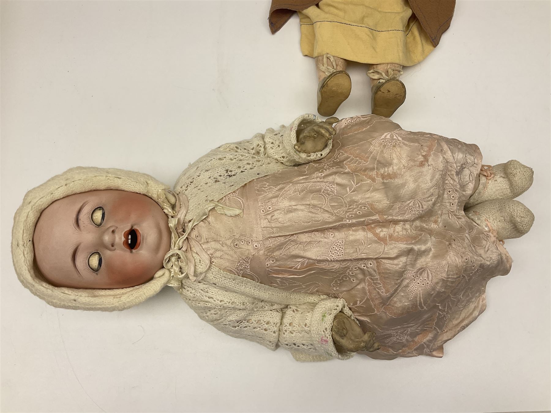Catterfelder Puppenfabrik Germany bisque head baby doll with moulded hair, sleeping eyes, open mouth with teeth and trembly tongue, and composition body with jointed limbs; marked 'C.P. 208/50 V S' H50cm; together with an Armand Marseille bisque head doll with applied hair, sleeping eyes, open mouth with teeth and composition body with jointed limbs; marked 'Made in Germany Armand Marseille 390n D.R.G.M. 246/1 A. 6 M.' H56cm (2)