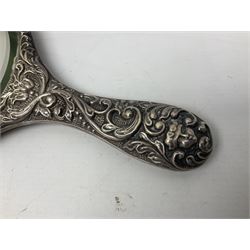 Silver mounted dressing table mirror, embossed with birds, masks, and foliate and C scrolls, hallmarked Birmingham, and fruit knife with mother of pearl handle and silver blade, (2)